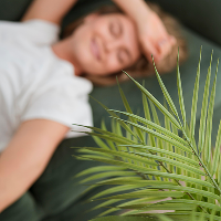 high-view-blurred-woman-sitting-couch